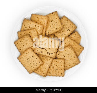crackers in plate on white Stock Photo