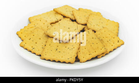 crackers in plate on white Stock Photo