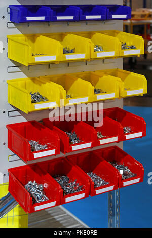 Colourful plastic sorting bins with nuts and bolts Stock Photo