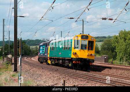 A class 37 diesel locomotive number 37409 propelling inspection saloon number 975025 'Caroline' at East Hyde on the 10th May 2011. Stock Photo