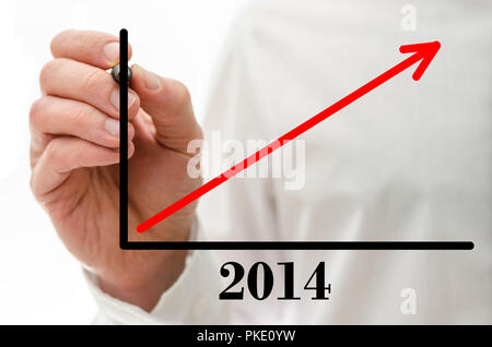 Closeup of male hand drawing business success graph on virtual screen. Stock Photo