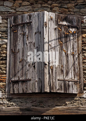 weathered shuttered window on aged wall Stock Photo - Alamy