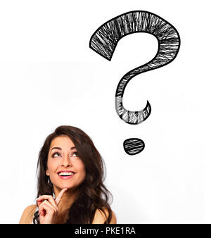Thinking smiling positive woman looking up on one big creative question marks above the head on white isolated background with empty space Stock Photo