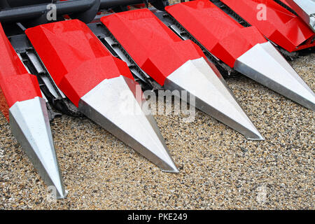 Corn harvester head with several silver blades Stock Photo