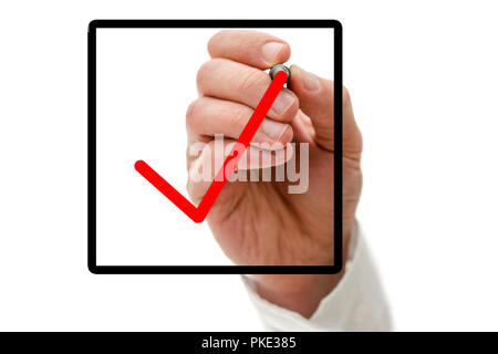 Closeup of male hand drawing red tick in check box on virtual screen. Stock Photo