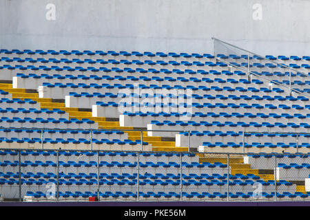 Row of blue seats on empty stadium. Stock Photo