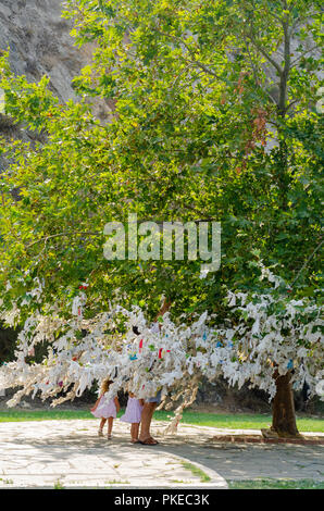 The wishing tree near Statue of Virgin Mary in Turkey, believed by some pilgrims to be miraculous. Stock Photo