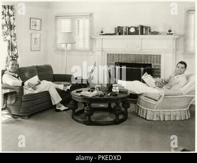 Cary Grant and Randolph Scott relaxing in their house known as the “Bachelor Hall” in Santa Monica, California which they purchased and shared for 12 years after meeting on the set of Hot Saturday (1932). Stock Photo