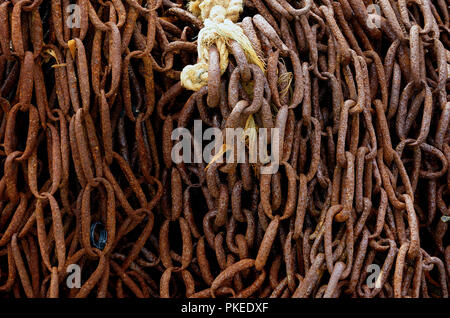 Chains hanging for use by the Stonehaven fishing fleet in Scotland Stock Photo