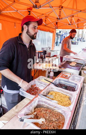 London England,UK,United Kingdom Great Britain,South Bank,Waterloo,historic Lower Marsh,street market,food vendor stall,server,adult adults man men ma Stock Photo