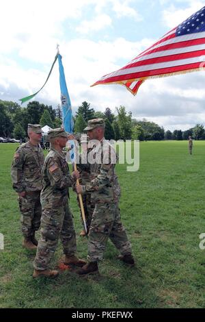 FORT GEORGE G. MEADE, Md. – Lt. Col. Justin Considine (left), the outgoing commander of the 781st Military Intelligence (MI) Battalion (Cyber), accepts the battalion colors from Command Sgt. Maj. Jesse Potter, during a change of command ceremony hosted by Col. Brian Vile, commander of the 780th MI Brigade (Cyber) on the McGlachlin Parade Field Aug. 1. Stock Photo