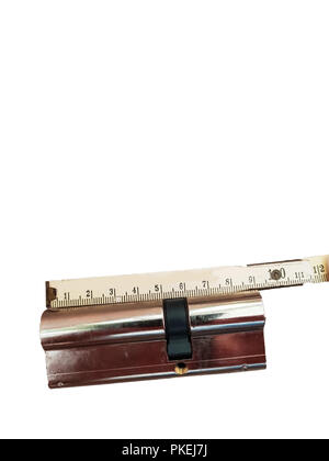 Locking cylinder without key with folding rule isolated on white background Stock Photo