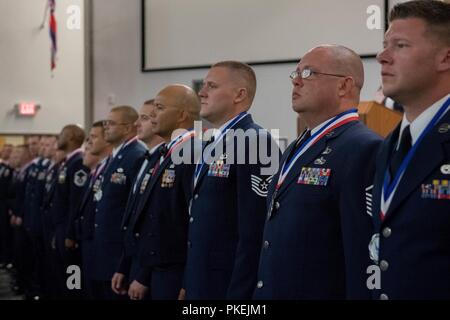 Technical sergeants celebrate their selction for master sergeant during a senior NCO induction ceremony at Barksdale Air Force Base, La., Aug. 10, 2018. Stock Photo