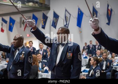 Technical sergeants celebrate their selction for master sergeant during a senior NCO induction ceremony at Barksdale Air Force Base, La., Aug. 10, 2018. Stock Photo