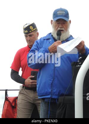 The Coast Guard Cutter Barracuda crew and members of the Korean War Veterans Association Chapter 176 commemorate the 65th anniversary of the Korean War armistice in Eureka, Calif., June 27, 2018. The ceremony included reading the names of several Humboldt Bay area natives who died during the Korean War and a wreath laying offshore. Stock Photo