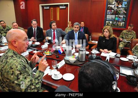 Mario Abdo Benitez, President-elect of Paraguay, listens to U.S. Navy Adm. Kurt Tidd, commander of U.S. Southern Command, while discussing the U.S.-Paraguay defense partnership during a meeting with members of the U.S. military headquarters July 30. The close collaborative ties between the United States and Paraguay include many decades of strong security cooperation based on common interests, shared goals and mutual respect. Stock Photo