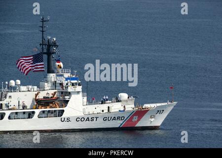 The crew of the Coast Guard Cutter Mellon, a 378-foot High Endurance Cutter home-ported in Seattle, participates in the annual Parade of Ships in Seattle, July 31, 2018.    The Parade of Ships is part of the annual Seattle Seafair air and sea events held each summer in the Seattle area.    U.S. Coast Guard Stock Photo