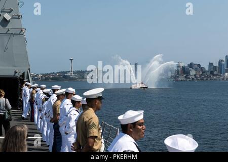 PUGET SOUND, Wash. (July 31, 2018) Sailors man the rails onboard the amphibious transport dock ship USS Somerset (LPD 25) as it sails in the Parade of Ships as part of Seattle's Seafair Fleet Week. Seafair Fleet Week is an annual celebration of the sea services wherein Sailors, Marines and Coast Guard members from visiting U.S. Navy and Coast Guard ships and ships from Canada make the city a port of call. Stock Photo