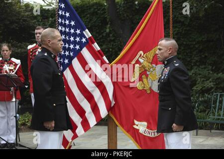 Commandant of the Marine Corps Gen. Robert B. Neller, left, prepares to promote Col. Daniel J. Lecce, right, during a ceremony held at Marine Barracks Washington, D.C., July 30, 2018. Col. Lecce was promoted to Maj. Gen. and appointed as the staff judge advocate to the Commandant of the Marine Corps. Stock Photo