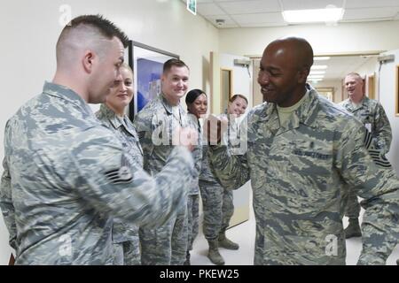 Chief Master Sgt. of the Air Force Kaleth O. Wright greets Airmen assigned to the 48th Medical Group during an immersion tour of Royal Air Force Lakenheath, England, Aug. 1, 2018. During his visit, Wright met with 48th Fighter Wing Airmen to answer questions and see how they take care of the mission. Stock Photo