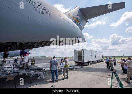 Charleston, S.C. (26 July, 2018) Members of the 437th Aerial Port Squadron and Space and Naval Warfare Systems Center (SSC) Atlantic engineers conduct a test load of a Large Mobile Air Traffic Control Tower (LMATCT) onto a C-17 Globemaster III July 26 at the Joint Base Charleston - Air Base. The test load was conducted in order to validate the Air Transportability Test Loading Activity certification and ensure the newly constructed towers were compatible for airlift aboard U.S. Air Force aircraft. The new models, specifically designed to be transportable on military airlift, directly support t Stock Photo