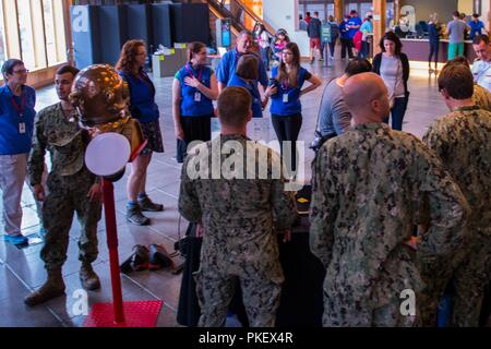 SEATTLE (August 02, 2018) Members of the Naval Station Everett dive locker interact with visitors at a static display held at the Seattle Aquarium during the 69th annual Seafair Fleet Week. Seafair Fleet Week is an annual celebration of the sea services wherein Sailors, Marines and Coast Guard members from visiting U.S. Navy and Coast Guard ships and ships from Canada make the city a port of call. Stock Photo