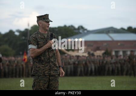 U.S. Marine Corps Maj. Gen. John K. Love, the outgoing commanding general of 2nd Marine Division, speaks during a change of command ceremony held on Camp Lejeune, N.C. Aug. 2, 2018. Love spoke on his time at the 2nd Marine Divsion and the support from his family. Stock Photo