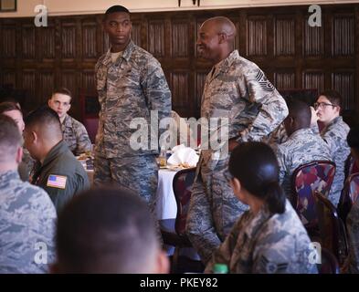 Chief Master Sgt. of the Air Force Kaleth O. Wright speaks with junior enlisted Airmen at RAF Mildenhall, England, Aug. 2, 2018. During the visit, Wright engaged Airmen from multiple units about resiliency, readiness and leadership. Stock Photo