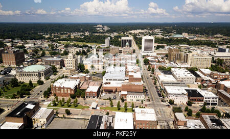 Blue skies with soft white clouds appear in the horizon over the landscape of downtown Macon Georgia Stock Photo