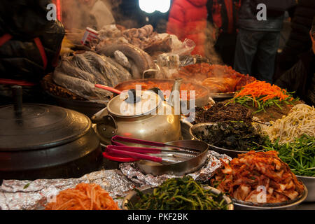 Traditional Korean food market with fresh kimchi, vegetables and meat. Outdoor fresh food market in Seoul South Korea. Stock Photo