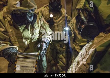 A Soldier wearing Mission Oriented Protective Posture (MOPP) gear test ...