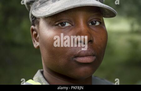 U.S. Army Reserve Sgt. Farah Mabou, assigned to the 367th Military Police Company, from Horsham, Pennsylvania, poses for a portrait between casualty care training events located on Fort McCoy, Wisconsin, Aug. 9, 2018. U.S. Army Reserve MPs were on McCoy, honing basic soldiering and MP specific skills such as detention operations and combat support. Stock Photo