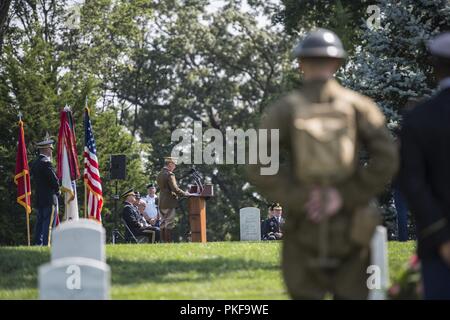 General of the Armies John Pershing re-enactor Chas Rittenhouse (left center) reads quotes from Pershing at a wreath-laying ceremony at the gravesite of Pershing in Section 34 of Arlington National Cemetery, Arlington, Virginia, August 10, 2018. The ceremony was hosted by First Army and commemorated its 100th birthday. Stock Photo