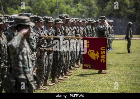 U.S. Marine Corps 2nd Battalion 3rd Marines Fox Company and 22nd Royal Malay Army Regiment stand at attention as the National anthems of the United States and Malaysia play at Malaysian Royal Army Base Kota Belud, Malaysia, August 10th, 2018. Marines and sailors with 3rd Marine Division and the 13th Marine Expeditionary Force will train with our allies in the Pacific for one month. Our comprehensive partnership with Malaysia is pivotal in maintaining regional security in the Indo-Pacific. Stock Photo