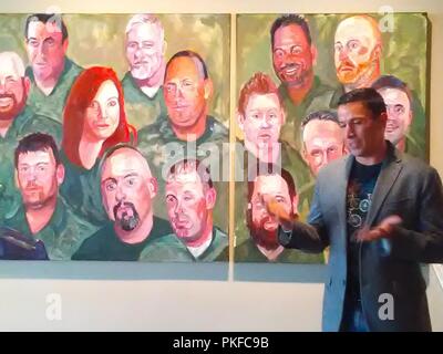 Maj Christopher Cordova, stands in front of the mural that includes his portrait, Aug. 7, 2018, while he describes how he was selected for President George W. Bush’s “Portraits of Courage” traveling art exhibit. The exhibit is currently on display at the Witte Museum in San Antonio, Texas, through Sept. 30.