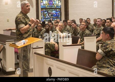 Rear Adm. Gregory Todd, the current Chaplain of the Marine Corps, Deputy Chief of Chaplains, Deputy Director of religious Ministries explains to Sailors they need to be ready for future conflicts during a visit to Marine Corps Base Camp Lejeune, Aug 9, 2018. Todd assumed his current duties as the 20th Chaplain of the Marine Corps in June 2018. Stock Photo