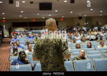 U.S. Marine Corps Col. William C. Bentley, commanding officer, Marine Corps Base Quantico (MCBQ), speaks during a town hall meeting at Little Hall, MCBQ, Va., Aug. 7, 2018. Town Halls are used by commanders to get in touch with Marines and to communicate general knowledge or to just tell stories. Stock Photo