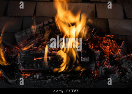 Wooden fire burning in a furnace, preparing for baking Stock Photo