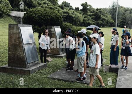 Teachers and students from both Achi Village of Shimoina District, Nagano Prefecture and Okinawa City, Japan, visited Kadena Air Base as part of their peace education, Aug. 6, 2018. The students were able to view war remnants that have been carefully preserved on Kadena. Stock Photo