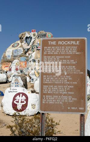 The Rockpile outside the National Training Center at Fort Irwin, Calif., Aug. 9, 2018, showcases the various units that have reported to NTC for warfighter training since the site opened 29 years ago. Each unit paints their crest with their unit’s name to signify their completion of the tough, realistic 28-day training scenarios that NTC provides to prepare units for mobilization. Stock Photo