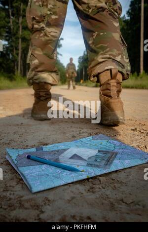 Pvt. Cody Young and Spc. Timothy Jordan of Alpha Troop,  6th Squadron, 8th Cavalry Regiment, 2nd Armored Brigade Combat Team, tally their pace count after plotting their coordinates, August 9, at Fort Stewart, Ga. Stock Photo