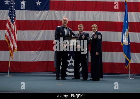 Technical sergeants celebrate their selction for master sergeant during a senior NCO induction ceremony at Barksdale Air Force Base, La., Aug. 10, 2018. Stock Photo