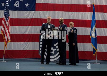 Technical sergeants celebrate their selction for master sergeant during a senior NCO induction ceremony at Barksdale Air Force Base, La., Aug. 10, 2018. Stock Photo