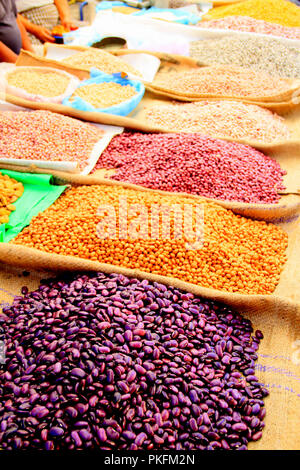 Pulses and Beans Displayed on Burlap Bags on Mexican market Stall Stock Photo