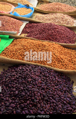 Pulses and Beans Displayed on Burlap Bags on Mexican market Stall Stock Photo