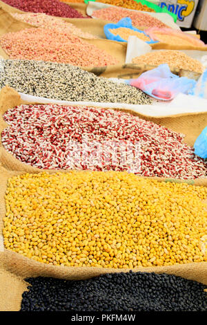 Pulses and Beans Displayed on Burlap Bags on Mexican market Stall Stock Photo