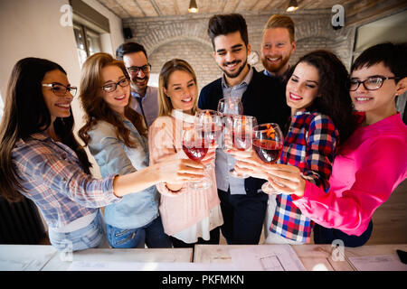 Group of successful architects celebrating in office Stock Photo