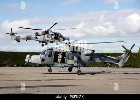 The Duke of Sussex (not seen) arrives in an AH1 wildcat helicopter with the 847 naval air squadron during a visit to the Royal Marines Commando Training Centre in Lympstone, Devon. Stock Photo