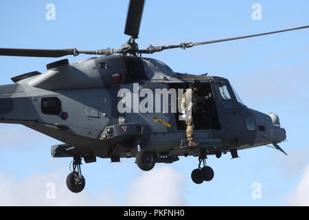 The Duke of Sussex (not seen) arrives in an AH1 wildcat helicopter with the 847 naval air squadron during a visit to the Royal Marines Commando Training Centre in Lympstone, Devon. Stock Photo