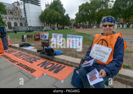 London, UK. 12th September 2018. The Guantanamo Justice Campaign hold one of their monthly vigils opposite Parliament calling on UK Prime Minister Theresa May to make urgent representations to President Trump to close Guantanamo and end the brutality and torture which is continuing against the 40 men still held there in indefinite detention. They call on Trump to respect human rights and international law, stating that the illegal camp is a legal and moral outrage and a symbol of US torture and injustice. Credit: Peter Marshall/Alamy Live News Stock Photo